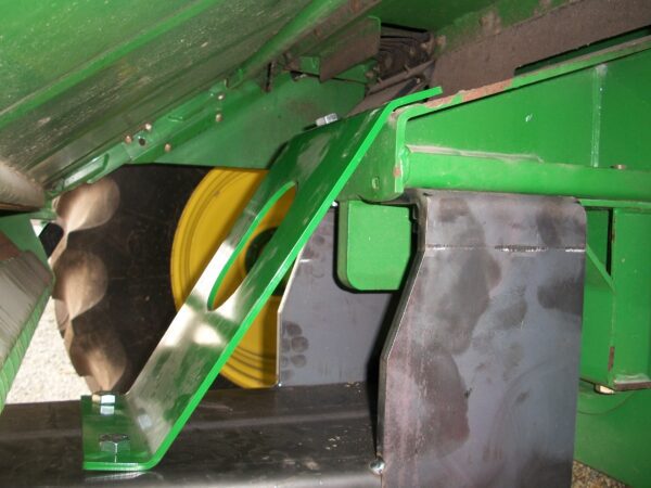 A green Combine Tow Hitch for John Deere "STS" Series with a green cover attached to it.