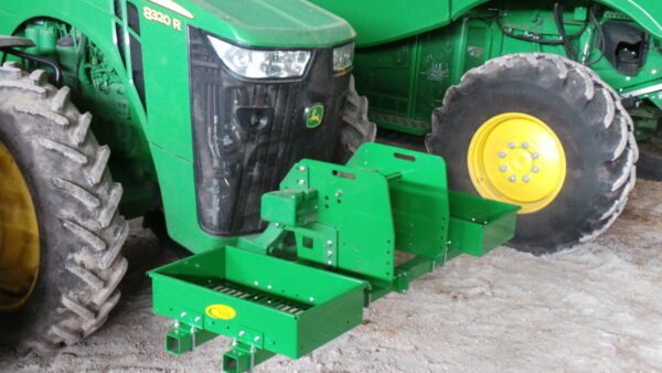 Two green Rock Boxes for John Deere 8000 Series without Weights parked next to each other.