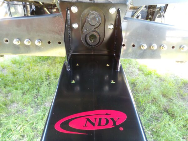 The rear end of a trailer with the Combine Tow Hitch for Case IH - newer models logo on it.