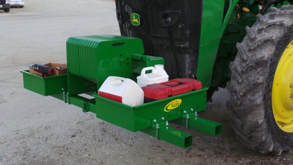 A green Rock Box for John Deere 5000, 6000, 7000, 8000 with weights tractor with a tank attached to it.