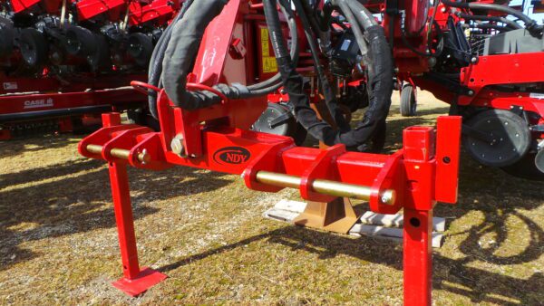 An Offset 3 Point Planter Hitch for Case IH 1200 Series with a hydraulic cylinder attached to it.