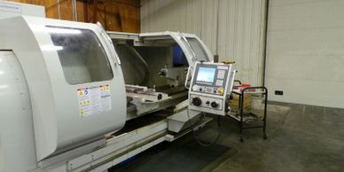 A cnc milling machine in a warehouse.