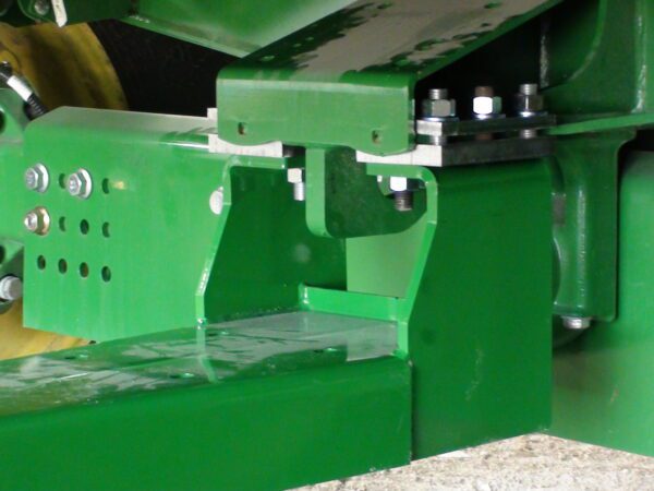 A close up of a Combine Tow Hitch for JD "S" Series 2013 and newer with a metal bracket.