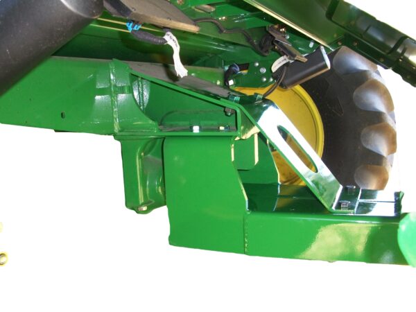 A green Combine Tow Hitch for JD "S" Series 2012 with a front end loader.