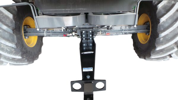 The rear end of a Combine Tow Hitch Lexion with a yellow tire.
