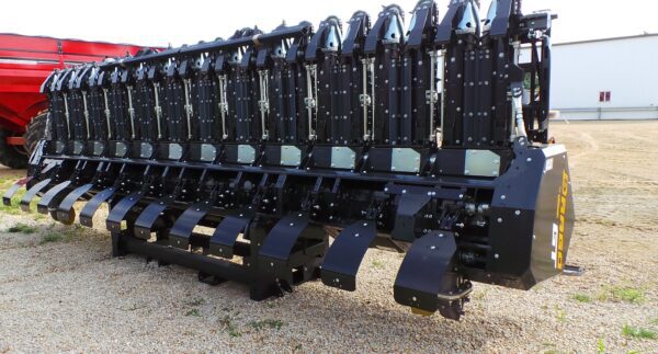 A tractor with a Stalk Stomper for Drago GT Series 12 Row 20" Corn Head attached to it.