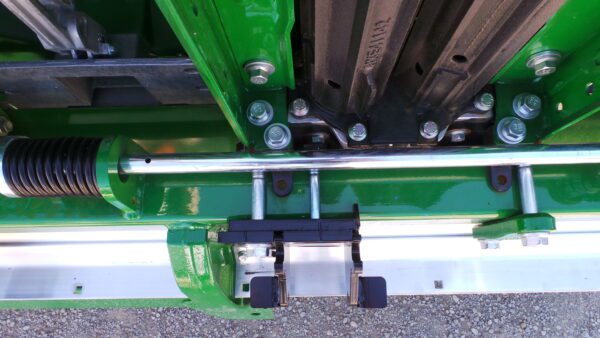 Green industrial machinery with metal components.