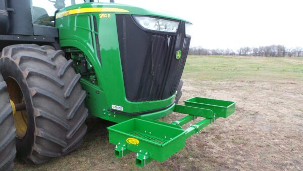 A Rock Box for John Deere 9000 Series tractor parked in a field.
