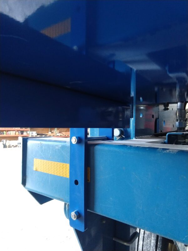 The back of a blue truck with a mounting bracket kit for large utility box - fits Kinze 3600 & 3660 planters.