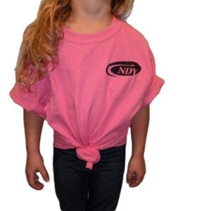 A young girl wearing the NDY Short Sleeve Children's T-shirt.
