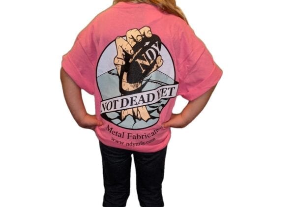 The back of a girl wearing a pink NDY Short Sleeve Children's T-shirt that says dead it.