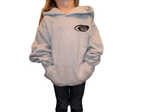 A girl wearing a NDY Hooded Sweatshirt - Children's with a logo on it.