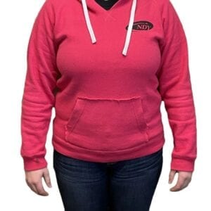 A woman wearing a NDY Hooded Sweatshirt - Women's and jeans.