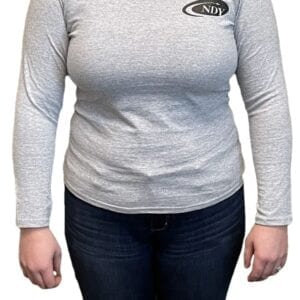 A woman wearing an NDY Long Sleeve Women's T-shirt.