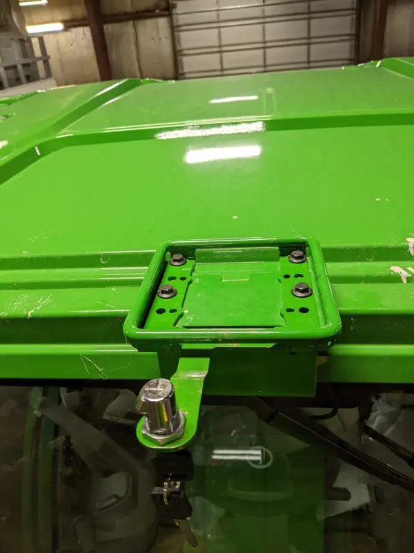 A GPS Globe Lock for John Deere® 6000 series StarFire tractor with a green hood.