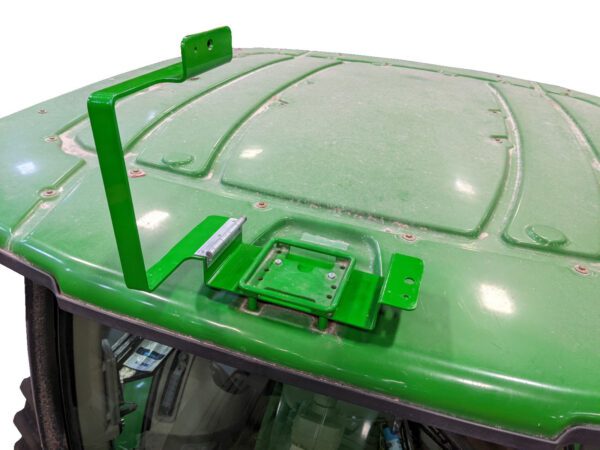 A GPS Hinged Globe Lock for John Deere® 6000 series StarFire tractor with a green hood.