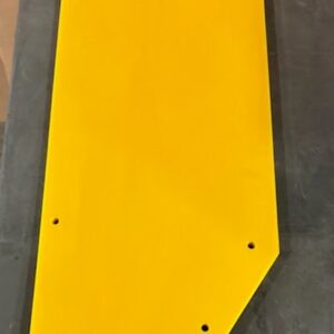 Yellow geometric panel with multiple holes.